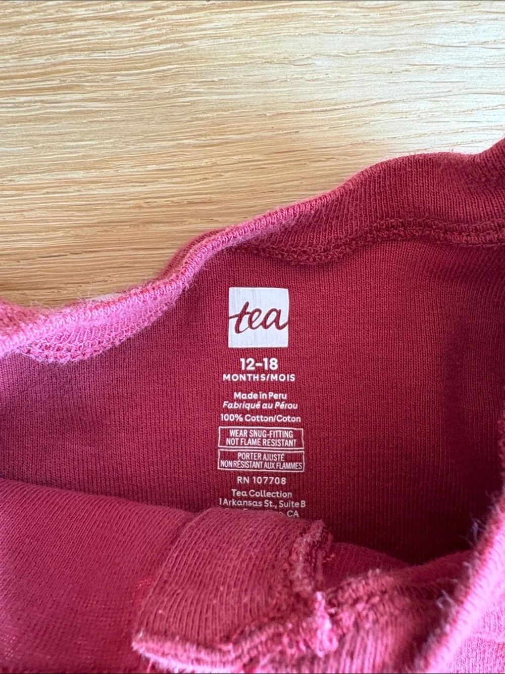 TEA COLLECTION | Berry Red Footed One-Piece with Reindeer Print